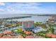 Aerial view of a waterfront high-rise building with parking and a pool at 4900 Brittany S Dr # 1303, St Petersburg, FL 33715