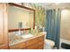 Bathroom with single sink, granite countertop, and tub shower combo at 4900 Brittany S Dr # 1303, St Petersburg, FL 33715