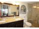 Elegant bathroom with double sinks, granite countertops, and a walk-in shower at 4900 Brittany S Dr # 1303, St Petersburg, FL 33715
