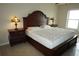 Spacious bedroom with large bed, nightstands, and ample natural light at 4900 Brittany S Dr # 1303, St Petersburg, FL 33715