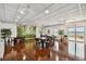 Community room with tables and tropical mural at 4900 Brittany S Dr # 1303, St Petersburg, FL 33715