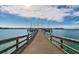 Long wooden dock extending into the water at 4900 Brittany S Dr # 1303, St Petersburg, FL 33715
