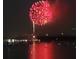 Vibrant red fireworks display over water at 4900 Brittany S Dr # 1303, St Petersburg, FL 33715