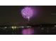 Purple fireworks display over water at night at 4900 Brittany S Dr # 1303, St Petersburg, FL 33715