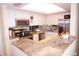 Spacious kitchen with granite countertops and stainless steel appliances at 4900 Brittany S Dr # 1303, St Petersburg, FL 33715