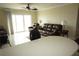 Living room with sliding glass doors and leather furniture at 4900 Brittany S Dr # 1303, St Petersburg, FL 33715