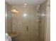 Clean shower with tiled walls and built-in seat at 4900 Brittany S Dr # 1303, St Petersburg, FL 33715