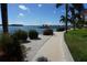 Scenic walkway with water views and lush landscaping at 4900 Brittany S Dr # 1303, St Petersburg, FL 33715