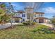 Beautiful two-story home with a double garage and lush landscaping at 231 Midway Is, Clearwater Beach, FL 33767