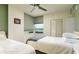 Bedroom with two twin beds, water view, and hardwood floors at 1540 Gulf Blvd # 806, Clearwater, FL 33767