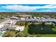 Aerial view of community with pool, lake, and numerous buildings at 6015 19Th N St # 308, St Petersburg, FL 33714
