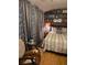 Bedroom with a unique chair and gray curtains at 6015 19Th N St # 308, St Petersburg, FL 33714