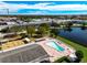 Community pool with surrounding patio and landscaping at 6015 19Th N St # 308, St Petersburg, FL 33714