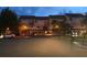 Night view of a townhome community with street parking and landscaping at 240 Windward Psge # 504, Clearwater, FL 33767