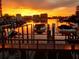 Boats docked at sunset, waterfront property with beautiful sunset views at 240 Windward Psge # 504, Clearwater, FL 33767