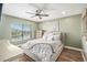 Serene bedroom with a plush bed and ceiling fan at 8210 Aquila St # 223, Port Richey, FL 34668