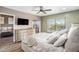 Main bedroom with a comfortable bed and access to a balcony at 8210 Aquila St # 223, Port Richey, FL 34668