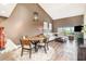 Bright dining area with wood table and seating for four at 8210 Aquila St # 223, Port Richey, FL 34668
