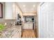 Modern kitchen with granite countertops and stainless steel appliances at 8210 Aquila St # 223, Port Richey, FL 34668