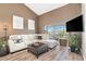 Spacious living room with L-shaped sofa and large TV at 8210 Aquila St # 223, Port Richey, FL 34668