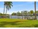 Private backyard with canal views, dock, and lush landscaping at 268 Sunlit Cove Ne Dr, St Petersburg, FL 33702