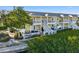 Two-story yellow building with balconies and waterfront access at 4740 Beach Se Dr # D, St Petersburg, FL 33705