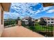 Spacious balcony with scenic views of the community and lush landscaping at 1500 Ember Ln, Tarpon Springs, FL 34689