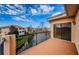 Private balcony overlooking a tranquil waterway and neighboring homes at 1500 Ember Ln, Tarpon Springs, FL 34689