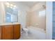 Clean bathroom with tub shower, vanity, and toilet at 1500 Ember Ln, Tarpon Springs, FL 34689