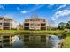 Three story home with pond views and lush landscaping at 1500 Ember Ln, Tarpon Springs, FL 34689