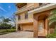 Two-car garage with paver driveway and gated entry at 1500 Ember Ln, Tarpon Springs, FL 34689