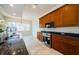 Modern kitchen featuring stainless steel appliances and dark wood cabinetry at 1500 Ember Ln, Tarpon Springs, FL 34689