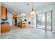 Open concept kitchen with breakfast nook and views of the living room at 1500 Ember Ln, Tarpon Springs, FL 34689