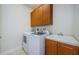 Laundry room with washer, dryer, and cabinets at 1500 Ember Ln, Tarpon Springs, FL 34689