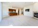Open concept living area with fireplace and kitchen views at 1500 Ember Ln, Tarpon Springs, FL 34689