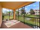 Relaxing screened porch overlooking a pond at 1500 Ember Ln, Tarpon Springs, FL 34689