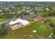 Aerial view of the community recreation area with pool, tennis courts, and golf course at 8551 Electra Ave, Brooksville, FL 34613