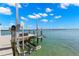 Boat dock with boat lift, providing convenient access to the water and scenic views at 295 Bayside Dr, Clearwater Beach, FL 33767