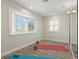 Brightly lit exercise room with bay windows and wood flooring at 295 Bayside Dr, Clearwater Beach, FL 33767