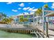 Impressive waterfront home with a pool, multiple balconies, and dock access, perfect for luxury living at 295 Bayside Dr, Clearwater Beach, FL 33767