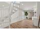 Hallway with winding staircase and built-in shelving at 295 Bayside Dr, Clearwater Beach, FL 33767