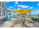 Enjoy the pool and comfortable outdoor seating with stunning waterfront views at 295 Bayside Dr, Clearwater Beach, FL 33767