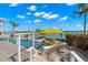 Enjoy waterfront views with a backyard pool and luxurious outdoor lounge area at 295 Bayside Dr, Clearwater Beach, FL 33767