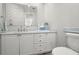 Powder room with marble countertop, and ample cabinet space at 295 Bayside Dr, Clearwater Beach, FL 33767