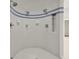 Modern shower with white tile, blue accents, and multiple shower heads at 295 Bayside Dr, Clearwater Beach, FL 33767