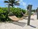 Two hammocks hanging on the beach near lush greenery at 5500 Gulf Blvd # 7211, St Pete Beach, FL 33706