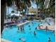 Crowded resort pool with many people enjoying a sunny day at 5500 Gulf Blvd # 7211, St Pete Beach, FL 33706