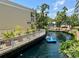 Two people in a paddle boat on a resort waterway at 5500 Gulf Blvd # 7211, St Pete Beach, FL 33706