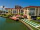 Aerial view of waterfront community with pool, dock, shuffleboard at 105 Island Way # 121, Clearwater Beach, FL 33767