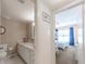 Bathroom with vanity, toilet, and access to bedroom at 105 Island Way # 121, Clearwater Beach, FL 33767
